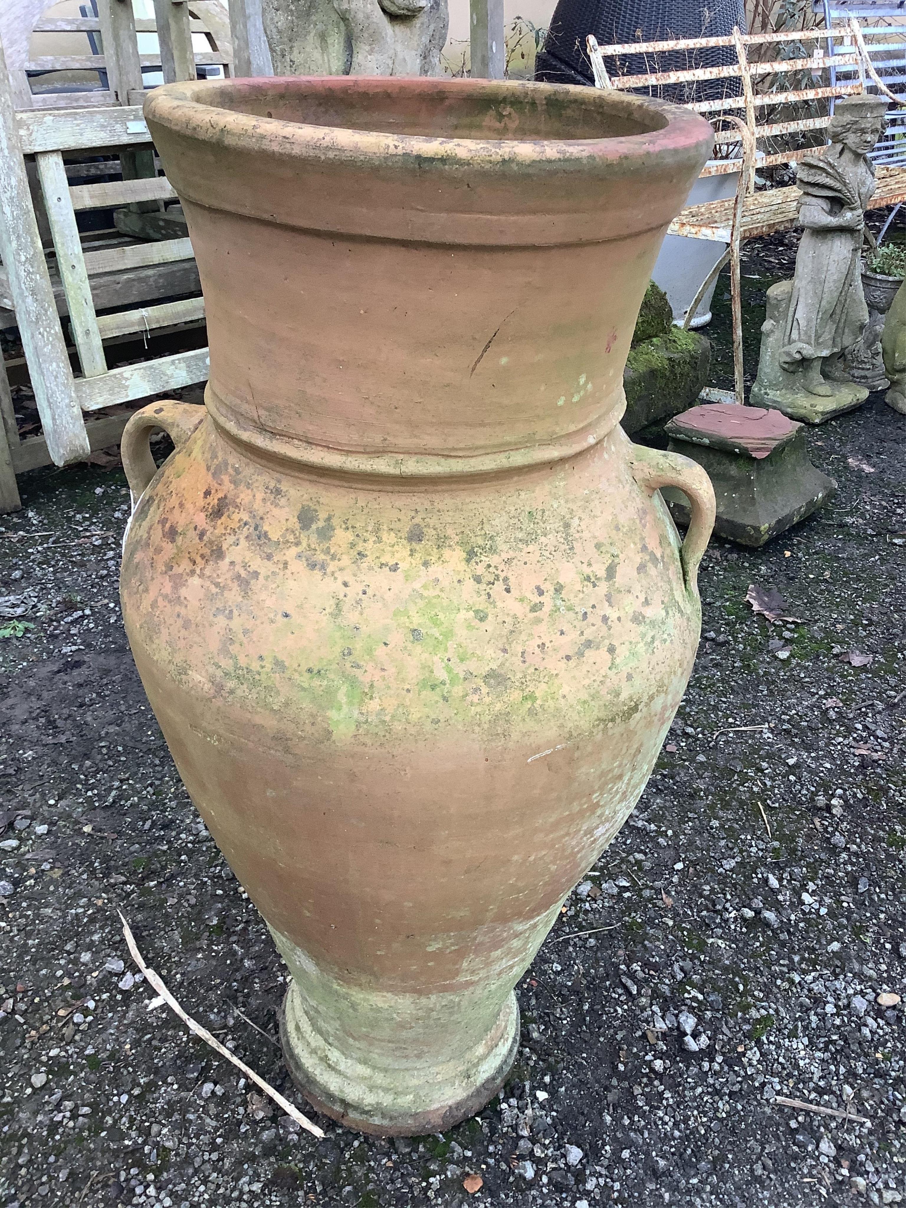 A Grecian style terracotta two handled garden urn, height 96cm. Condition - fair